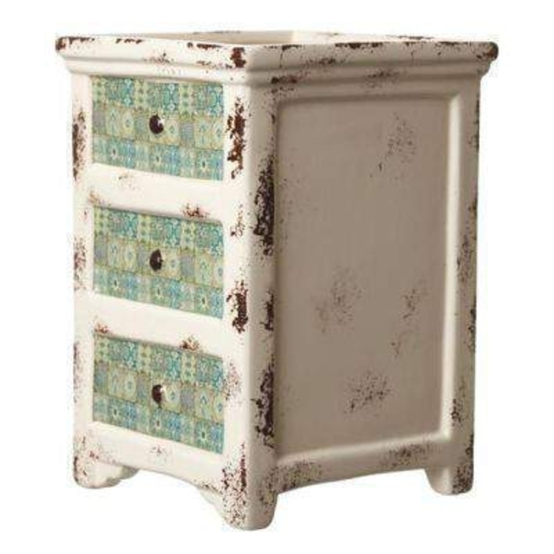 This Chest of Drawers Style Ceramic Pot by Heaven Sends would be a lovely addition to an inside or outside plant. In a distressed shabby chic style this cream ceramic pot has 3 featured drawers on the front of the pot in turquoise with an antique tile des